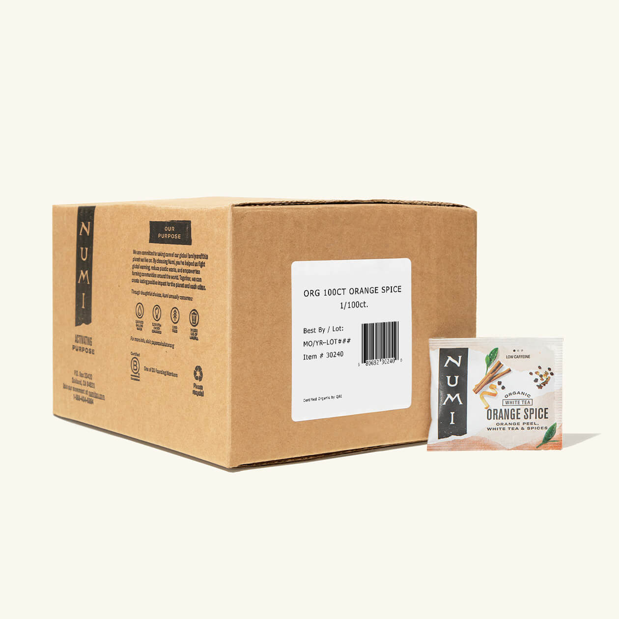 The 100 count box of Numi Orange Spice tea bags on a cream background