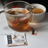 Brewing Numi's Orange Spice tea to make a simple syrup