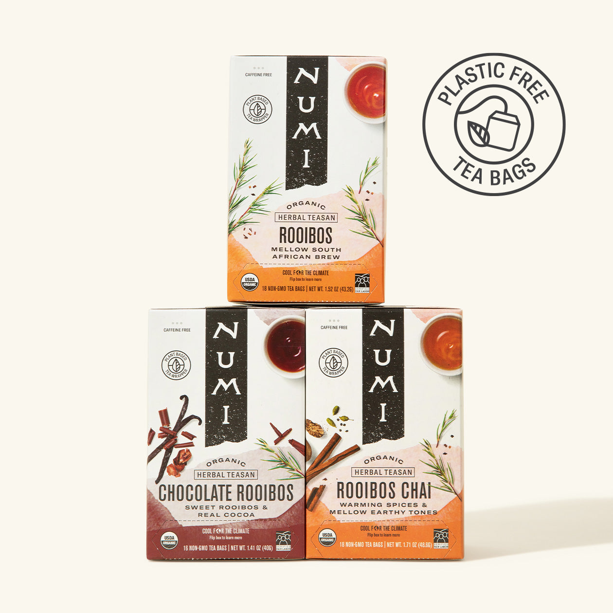 Three Numi tea boxes with rooibos and chocolate rooibos flavors on a white background.