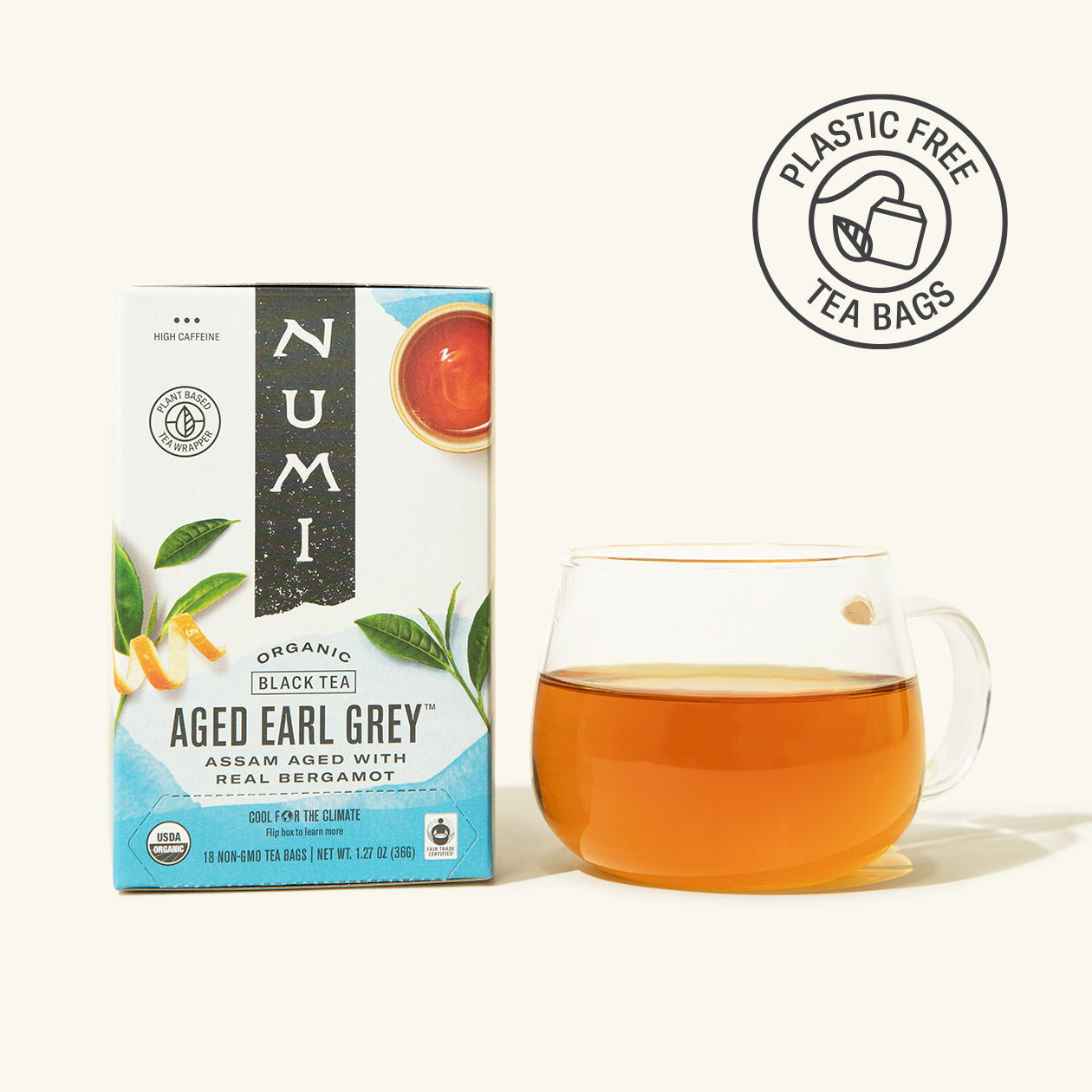 Numi Aged Earl Grey tea box with a cup of tea on a white background