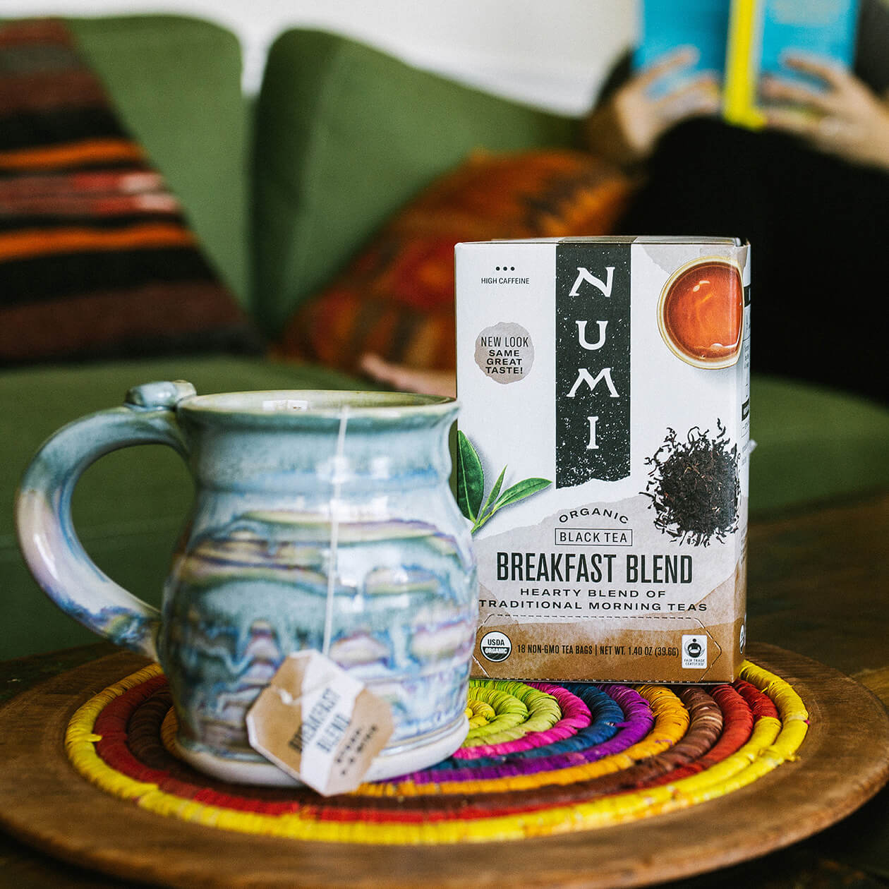 A hot cup of Numi Breakfast Blend tea in a modern styled living room