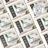 Collage of Numi Organic Tea Chinese Breakfast tea bags with a plastic-free logo.