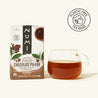 Numi Chocolate Pu-erh tea box with a cup of tea on a white background