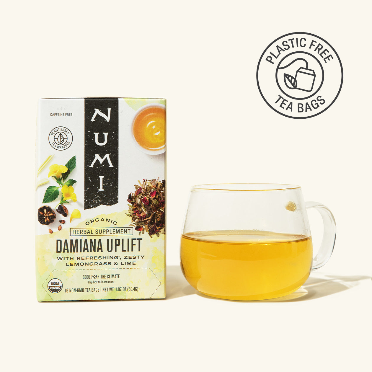 Numi Damaiana Uplift tea box with a glass of tea on a white background