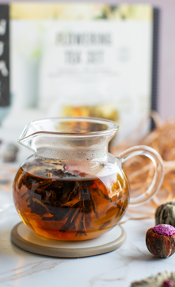 A glass teapot gift with flowering tea