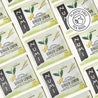 Multiple Numi Ginger Lemon tea bags arranged in a pattern.