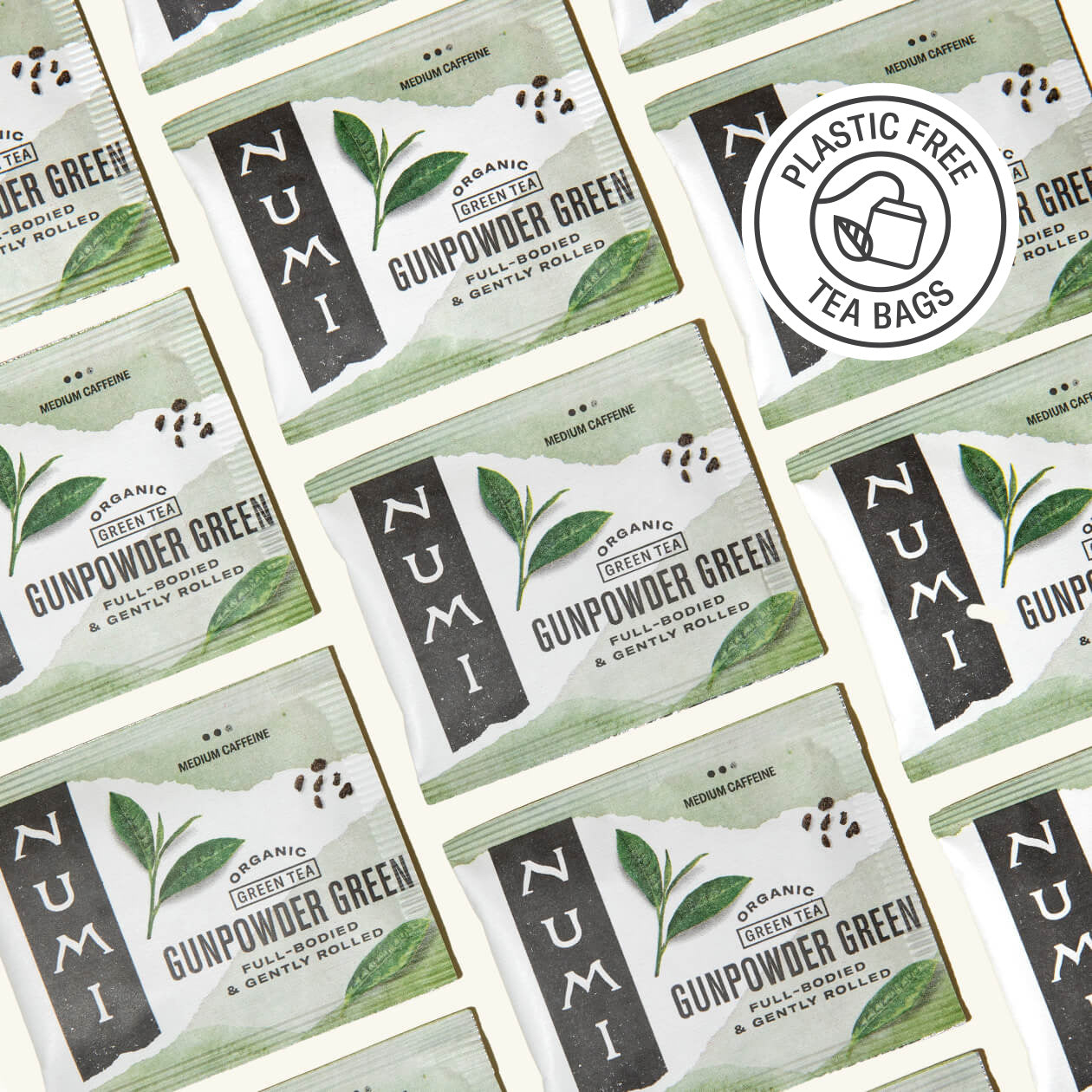 Pattern of Numi Gunpowder Green tea packages with a plastic-free logo.