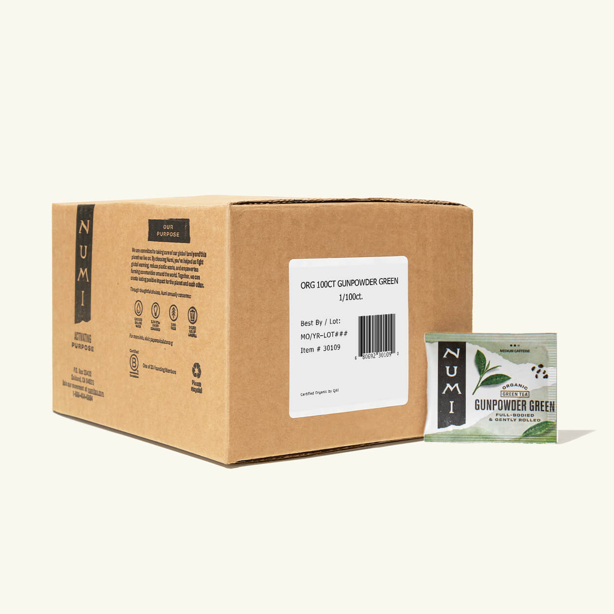 The 100 count box of Numi Gunpowder Green tea bags on a cream background
