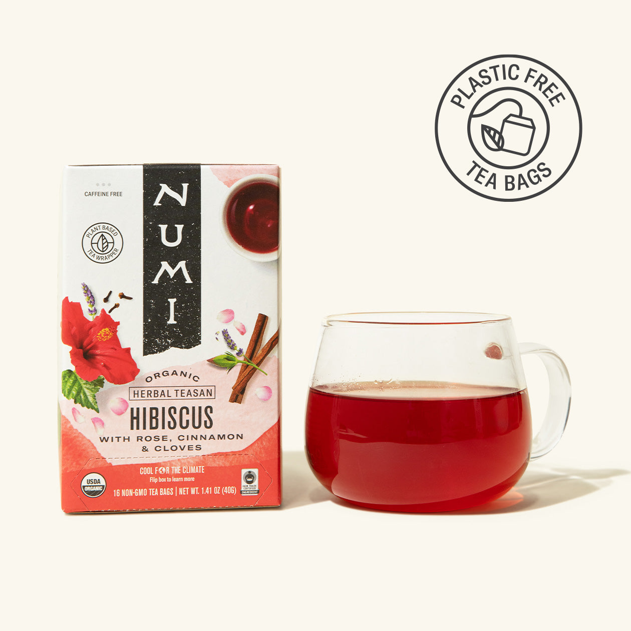 Numi Organic Hibiscus tea box with a glass of red tea on a white background