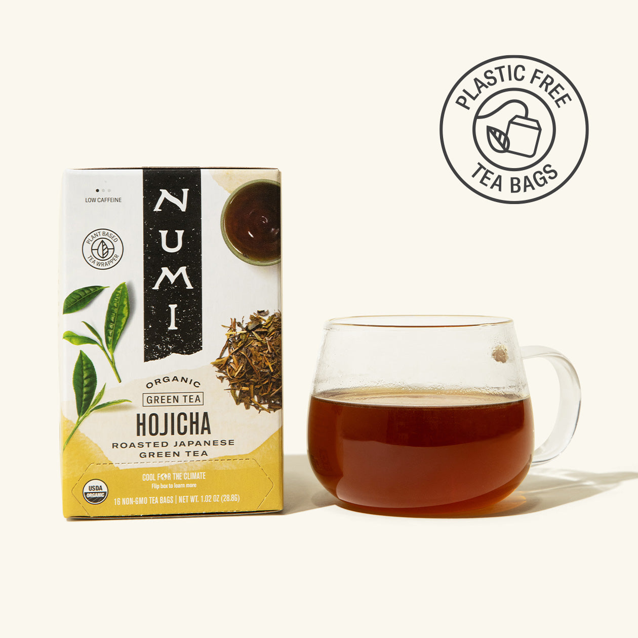 Numi Hojicha green tea box with a cup of tea on a white background