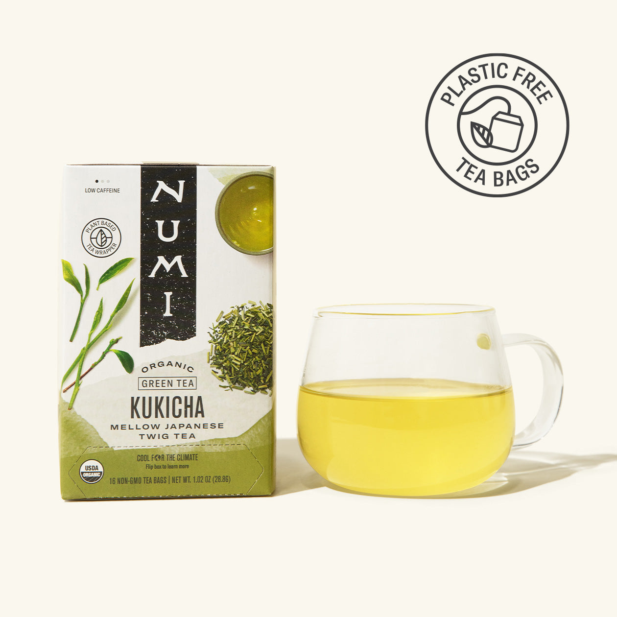 A box of Numi Organic Kukicha green tea with a brewed cup