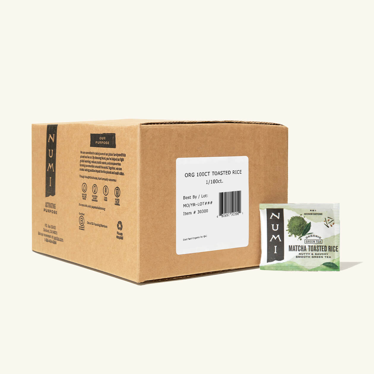 The 100 count box of Numi Matcha Toasted Rice tea bags on a cream background