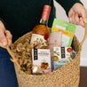 A Numi Mini sampler included in a woven gift basket with other gifts