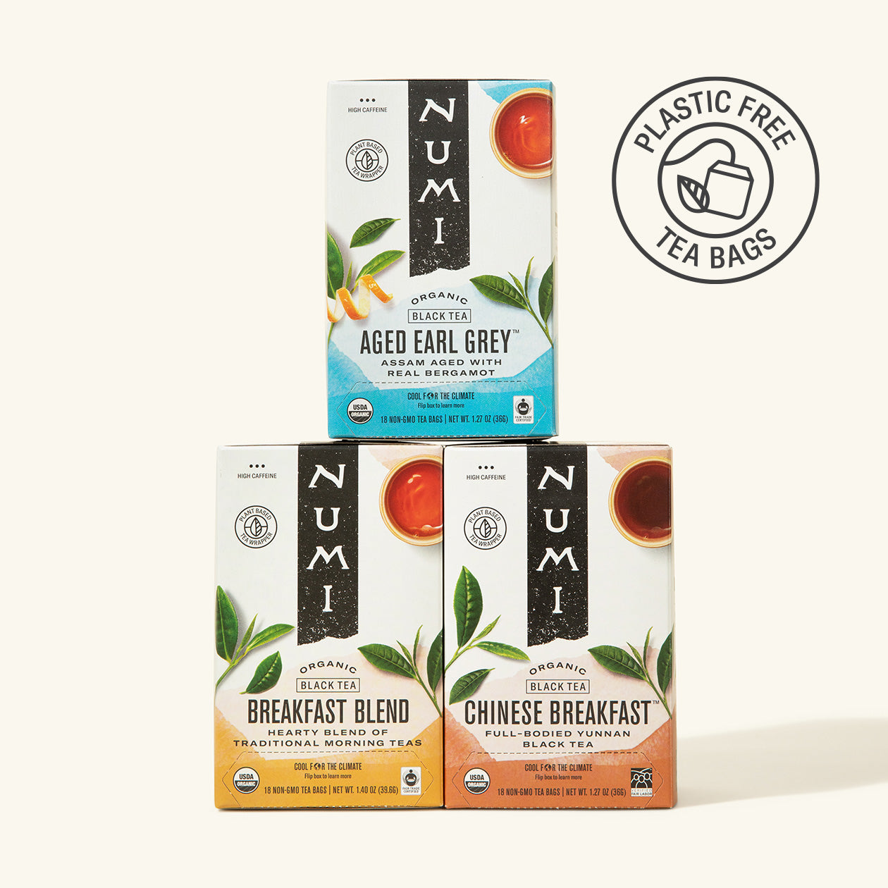 Three Numi tea boxes stacked on a white background with a plastic-free logo.