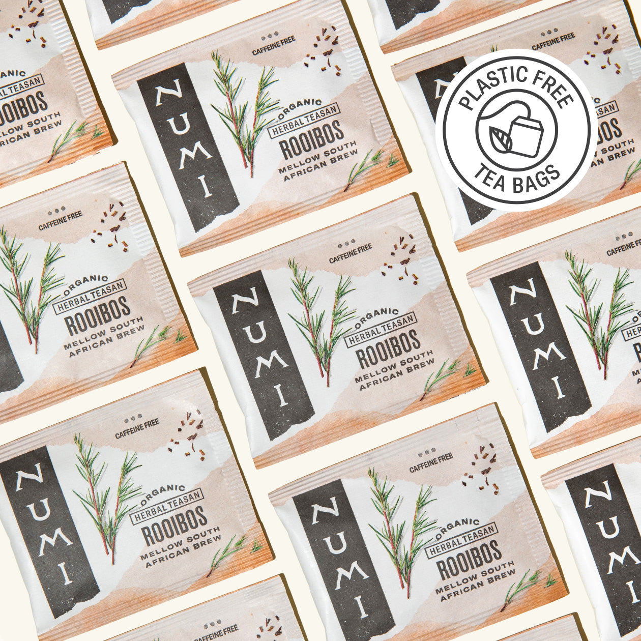 Pattern of Numi Rooibos tea bags with a plastic-free logo.