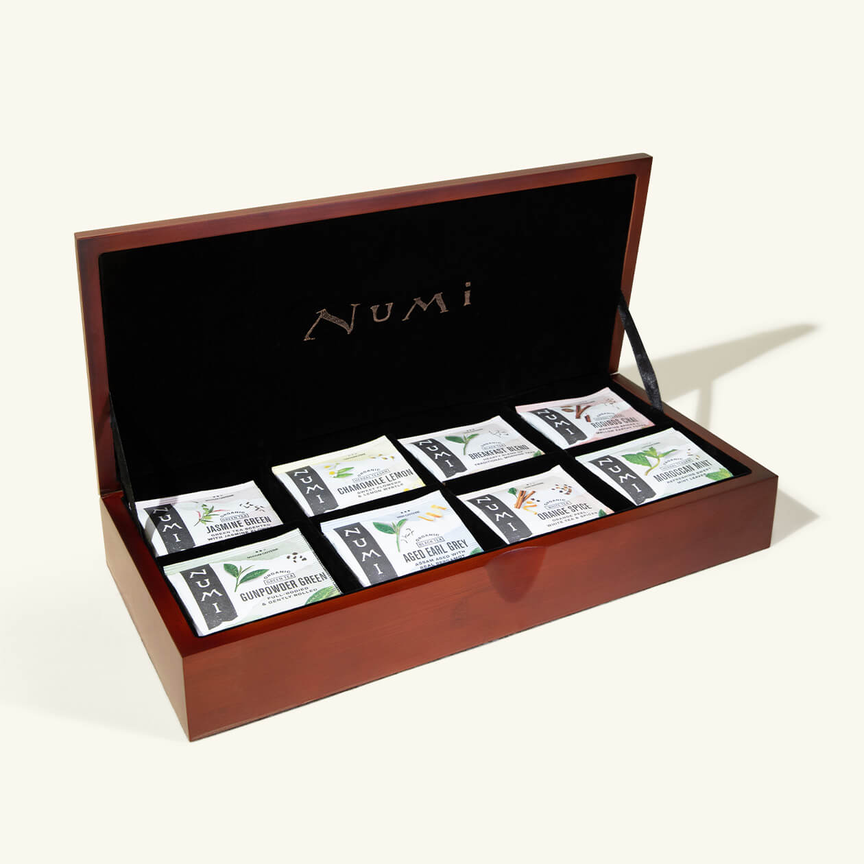 Numi's most elegant tea chests are velvet lined with a mahogany finish and hold 8 varieties of tea bag.