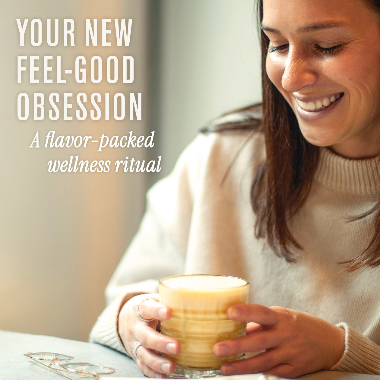 Woman holding a mug with text about a 'feel-good' obsession and wellness ritual.