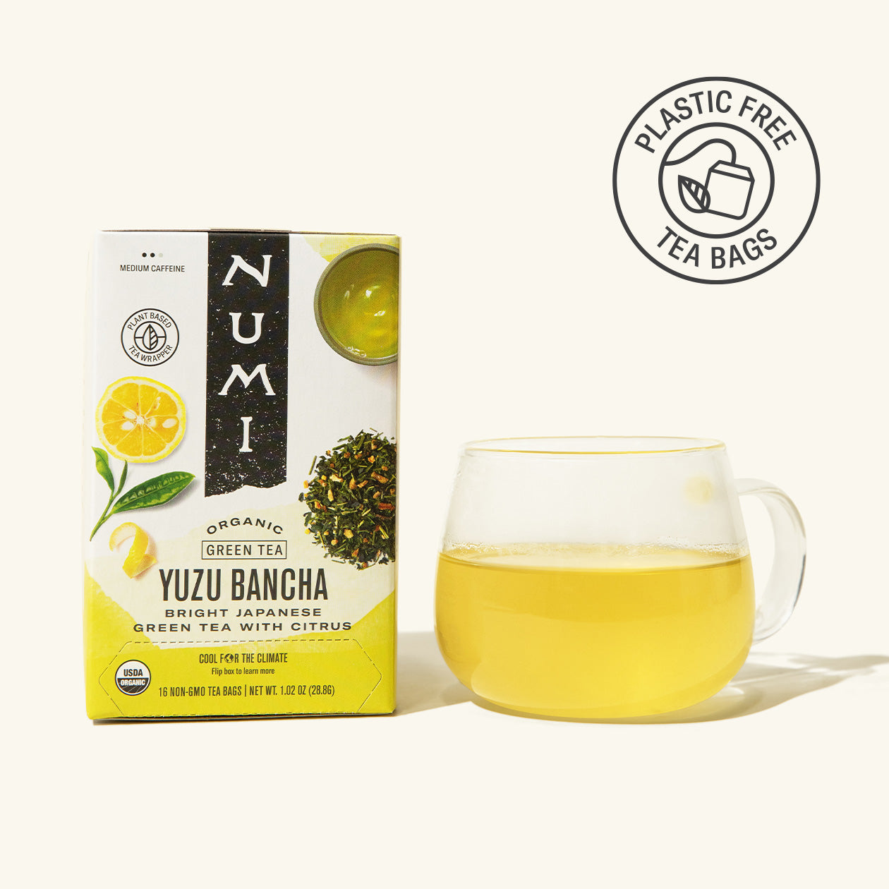 Numi Yuzu Bancha tea box with a glass of tea on a white background