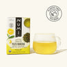 Numi Yuzu Bancha tea box with a glass of tea on a white background